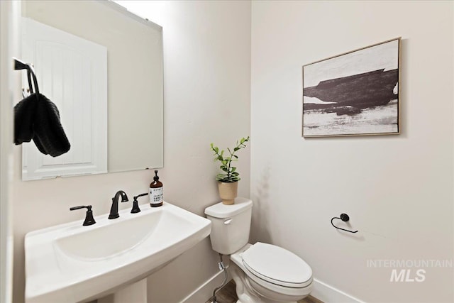 bathroom with sink and toilet