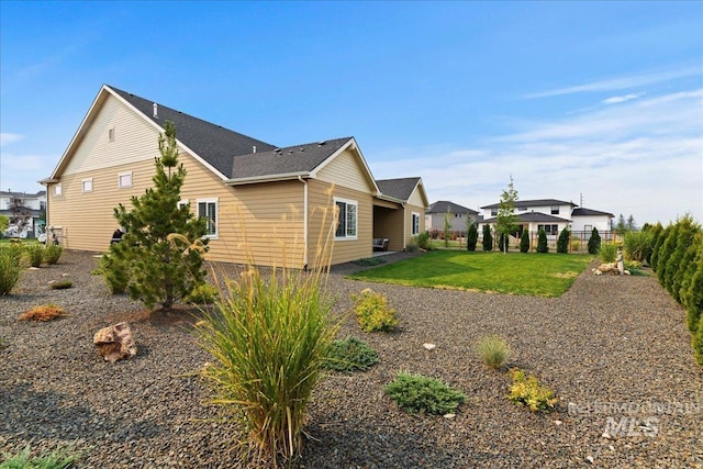 view of home's exterior featuring a yard