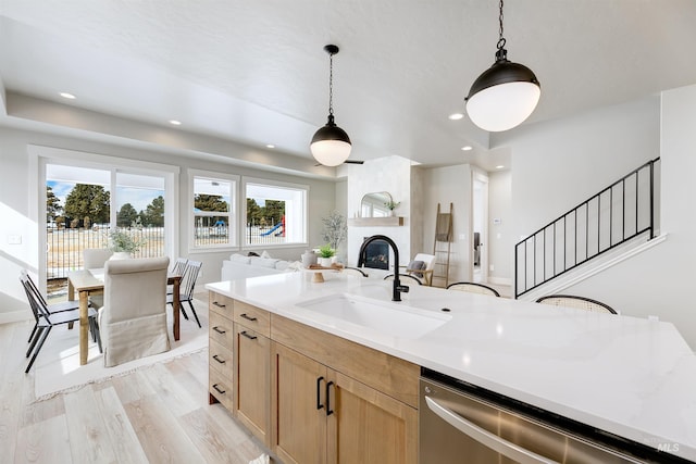 652 N Morning Glory, Eagle, ID 83616 - kitchen with open floor plan, stainless steel dishwasher, hanging light fixtures, a sink, and light brown cabinets