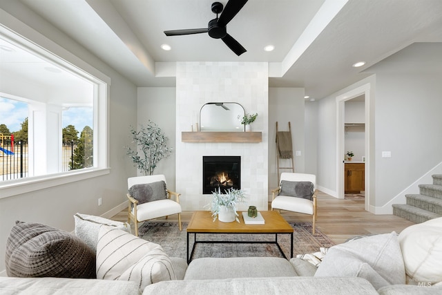 652 N Morning Glory, Eagle, ID 83616 - living room with recessed lighting, baseboards, a ceiling fan, a tile fireplace, and wood finished floors