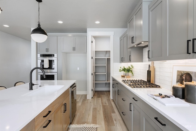 652 N Morning Glory, Eagle, ID 83616 - kitchen featuring light countertops, a sink, and appliances with stainless steel finishes