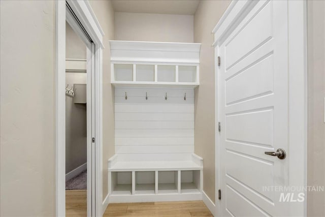 mudroom with light wood-style flooring