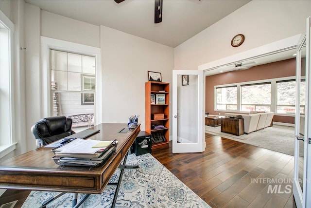 office featuring french doors, ceiling fan, lofted ceiling, and dark hardwood / wood-style flooring