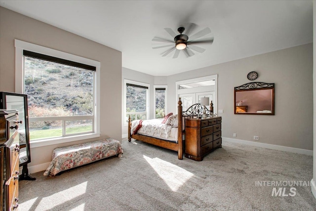 carpeted bedroom featuring ceiling fan