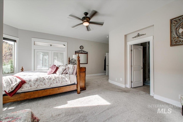 bedroom with ceiling fan and light colored carpet