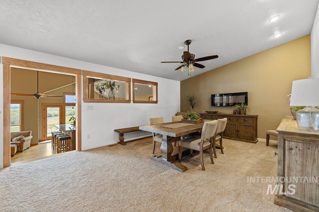 41 Knob Hill Dr, Mccall, ID 83638 - dining room with a ceiling fan, vaulted ceiling, light carpet, and baseboards