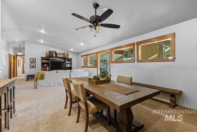 41 Knob Hill Dr, Mccall, ID 83638 - dining area featuring light carpet, vaulted ceiling, ceiling fan, recessed lighting, and baseboards