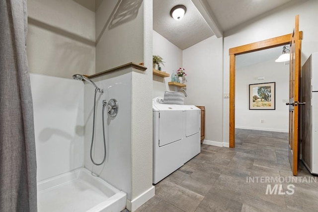 41 Knob Hill Dr, Mccall, ID 83638 - full bathroom with separate washer and dryer, stone finish flooring, curtained shower, baseboards, and vanity