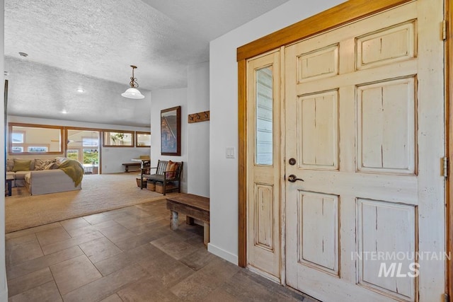 41 Knob Hill Dr, Mccall, ID 83638 - foyer entrance featuring a textured ceiling and baseboards
