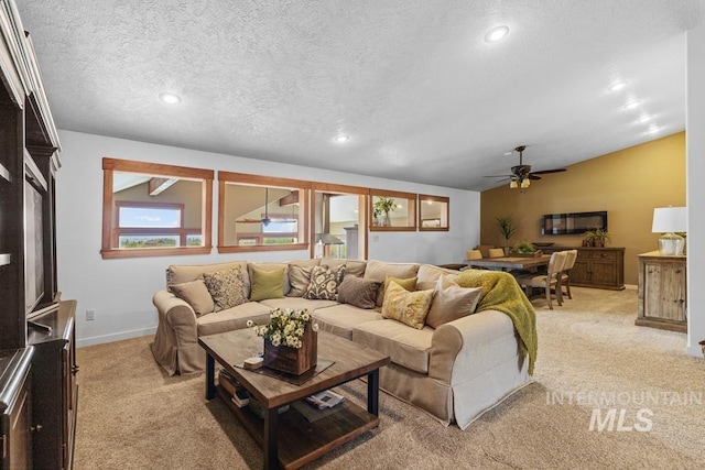 41 Knob Hill Dr, Mccall, ID 83638 - living area featuring light carpet, ceiling fan, baseboards, recessed lighting, and lofted ceiling