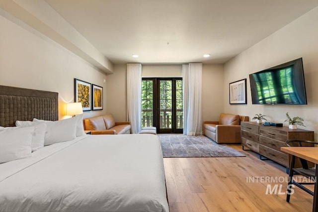 bedroom featuring wood-type flooring and recessed lighting