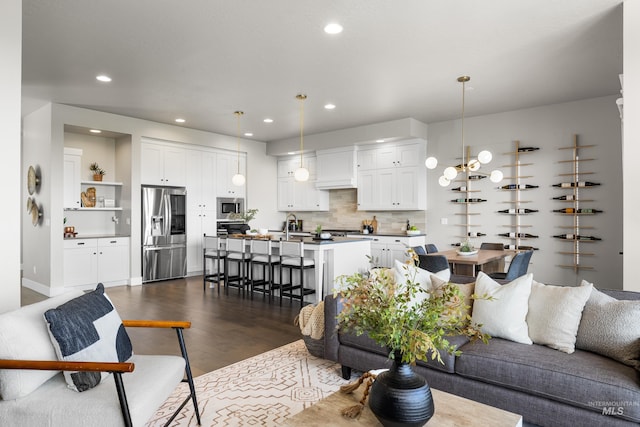 6799 E Warm Springs Ave, Boise, ID 83716 - living room featuring dark wood finished floors and recessed lighting