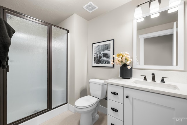 6799 E Warm Springs Ave, Boise, ID 83716 - bathroom featuring vanity, a shower stall, toilet, and baseboards