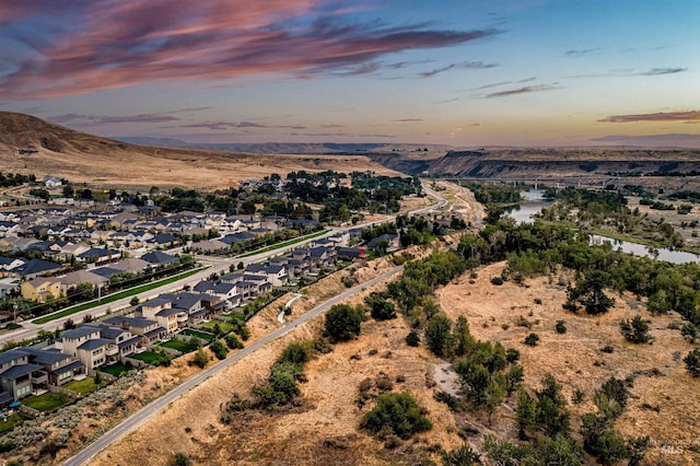 6799 E Warm Springs Ave, Boise, ID 83716 - aerial view at dusk of a residential view and a water and mountain view