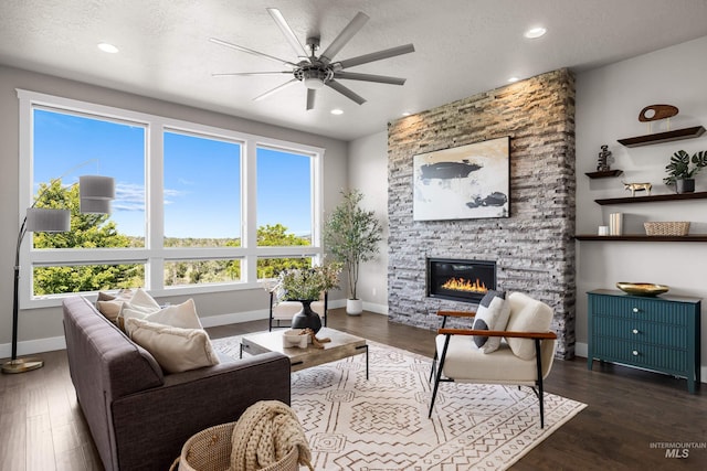 6799 E Warm Springs Ave, Boise, ID 83716 - living room with ceiling fan, a fireplace, wood finished floors, recessed lighting, and a textured ceiling