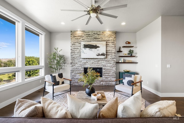 6799 E Warm Springs Ave, Boise, ID 83716 - living room with a ceiling fan, wood finished floors, a stone fireplace, baseboards, and recessed lighting