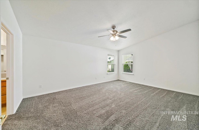 431 N David Frost St, Nampa, ID 83651 - carpeted spare room featuring ceiling fan, baseboards, vaulted ceiling, and a textured ceiling