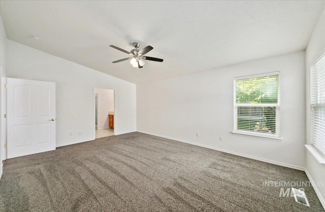 431 N David Frost St, Nampa, ID 83651 - unfurnished bedroom featuring carpet, vaulted ceiling, baseboards, a ceiling fan, and connected bathroom