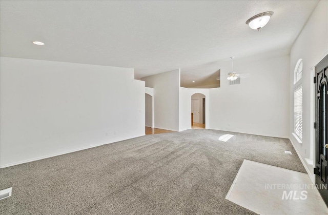 431 N David Frost St, Nampa, ID 83651 - empty room featuring arched walkways, carpet floors, a ceiling fan, baseboards, and recessed lighting