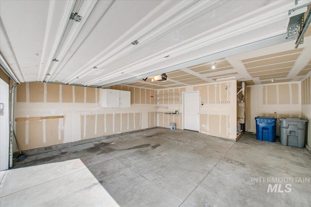 431 N David Frost St, Nampa, ID 83651 - garage featuring a garage door opener and gas water heater