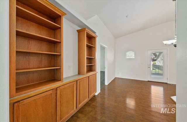 431 N David Frost St, Nampa, ID 83651 - corridor featuring dark wood-style floors, vaulted ceiling, and built in shelves