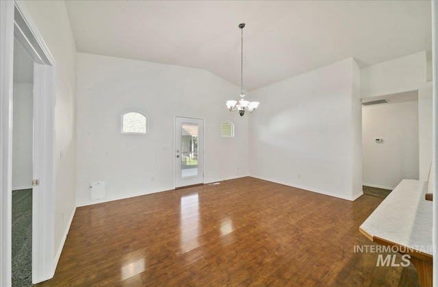 431 N David Frost St, Nampa, ID 83651 - unfurnished dining area with a chandelier, vaulted ceiling, wood finished floors, and baseboards