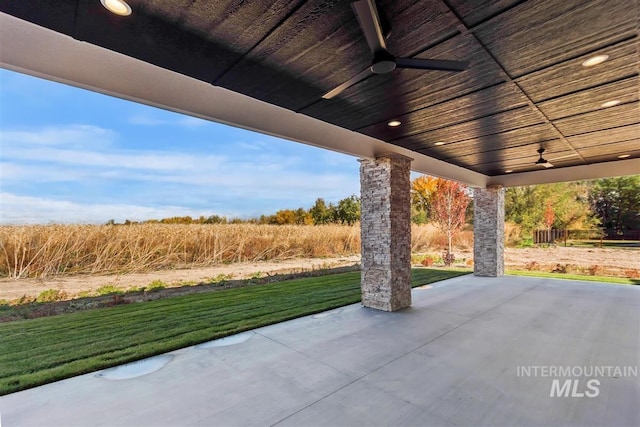 view of patio featuring ceiling fan