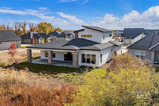 back of house featuring a patio