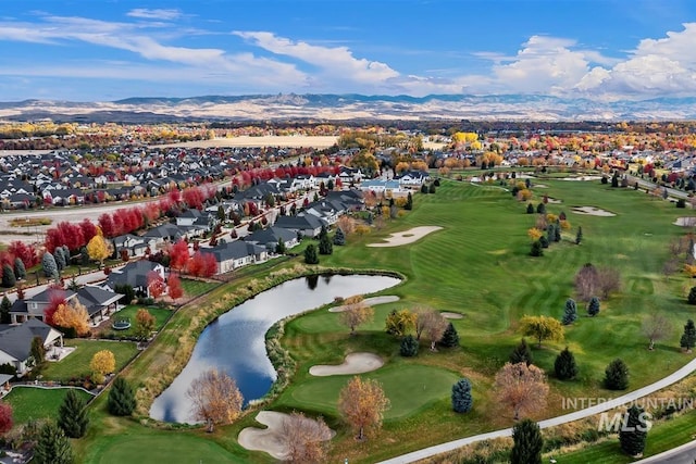 drone / aerial view with a water and mountain view