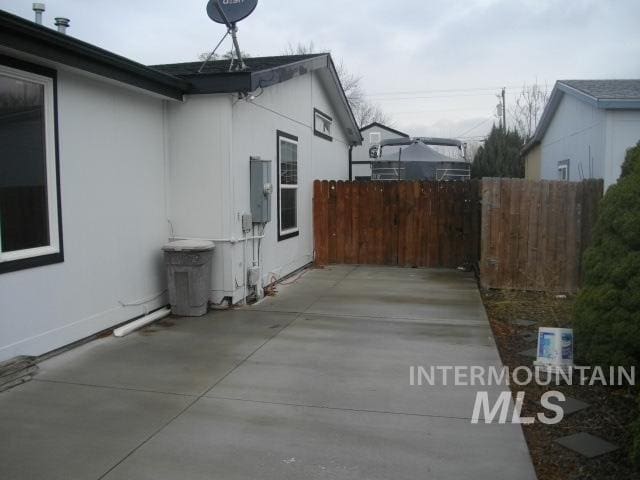 view of side of property with a patio area