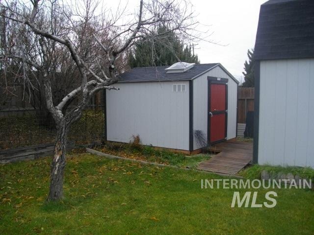 view of outbuilding featuring a lawn