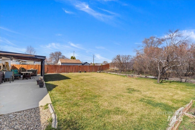 view of yard with a patio and a fenced backyard