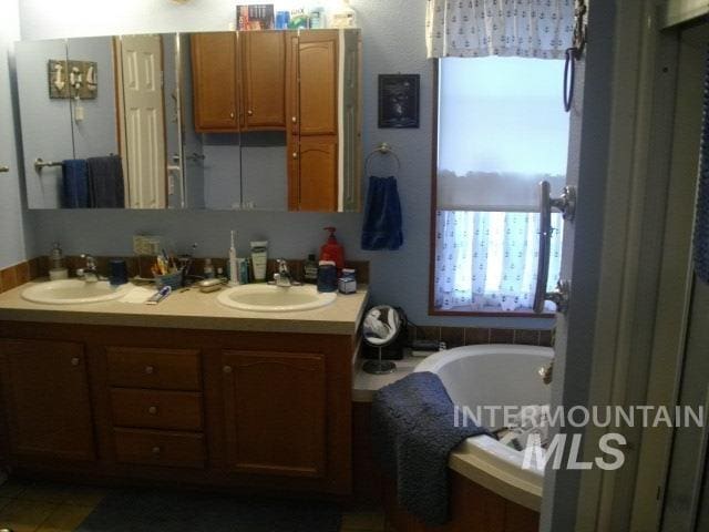 bathroom featuring a tub and vanity