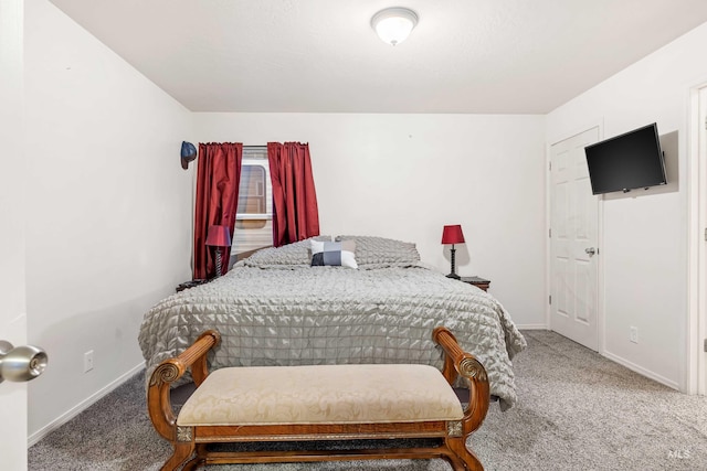 carpeted bedroom featuring baseboards