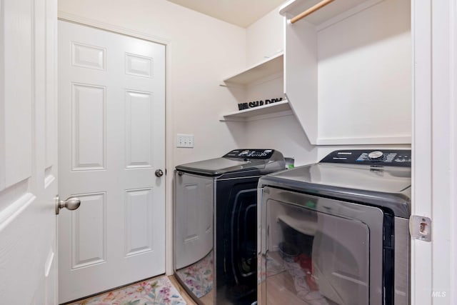 clothes washing area with laundry area and washing machine and clothes dryer