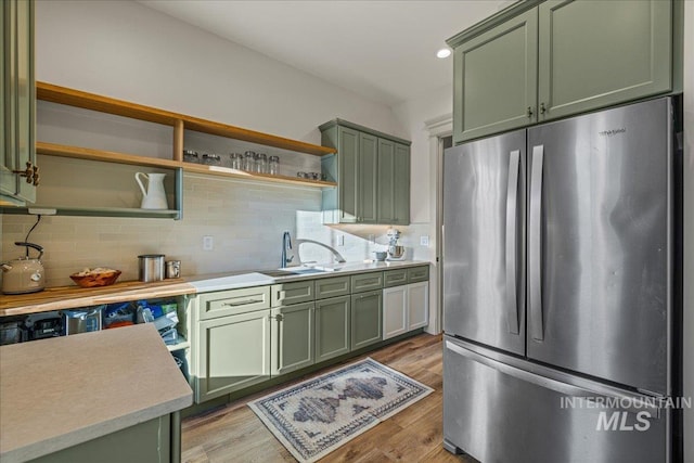 25580 Gooseberry Ln, Caldwell, ID 83607 - kitchen featuring freestanding refrigerator, green cabinets, open shelves, a sink, and recessed lighting