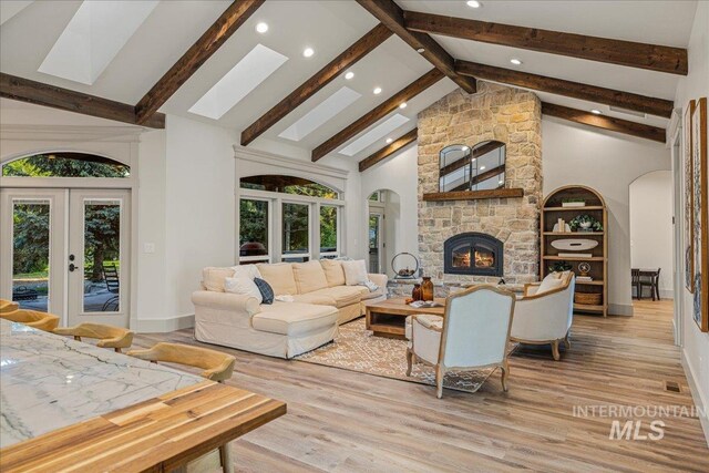 25580 Gooseberry Ln, Caldwell, ID 83607 - living area featuring recessed lighting, arched walkways, plenty of natural light, french doors, and light wood finished floors