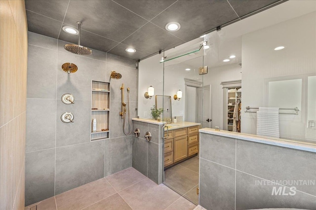 25580 Gooseberry Ln, Caldwell, ID 83607 - bathroom with a walk in shower, vanity, tile patterned floors, a spacious closet, and recessed lighting