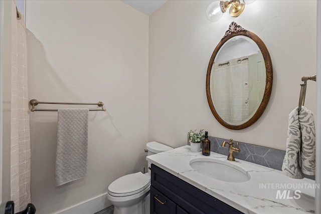 25580 Gooseberry Ln, Caldwell, ID 83607 - full bathroom featuring vanity, toilet, and a shower with curtain
