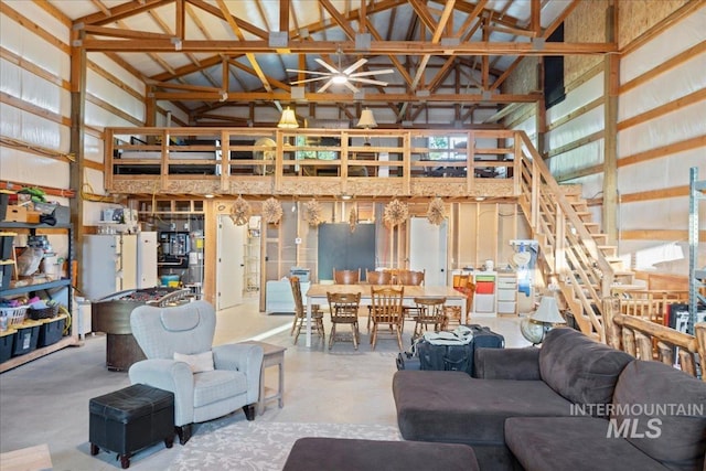 25580 Gooseberry Ln, Caldwell, ID 83607 - living area featuring high vaulted ceiling, finished concrete floors, and stairway