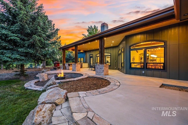 25580 Gooseberry Ln, Caldwell, ID 83607 - patio terrace at dusk with an outdoor fire pit and a patio