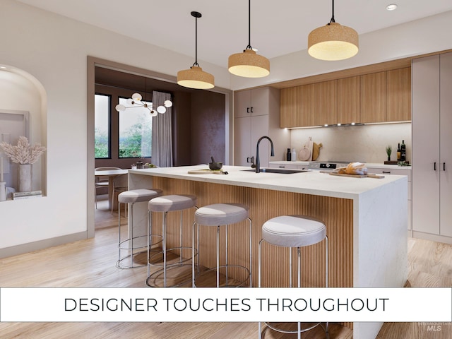 317 N River St Unit 3, Hailey, ID 83333 - kitchen with pendant lighting, modern cabinets, a center island with sink, a kitchen bar, and a sink