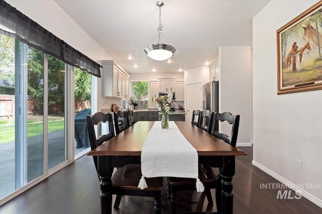 dining area with recessed lighting, baseboards, and dark wood-style floors