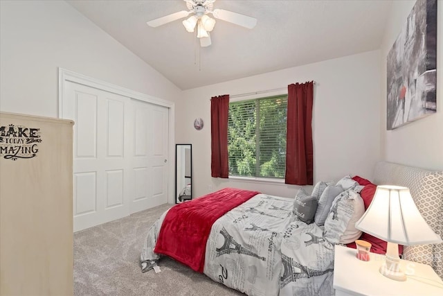 bedroom featuring carpet flooring, a ceiling fan, lofted ceiling, and a closet