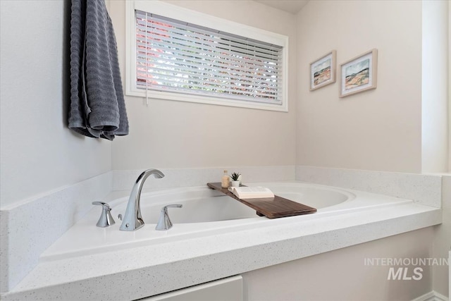 bathroom featuring a bath