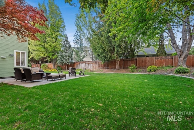 view of yard with an outdoor hangout area, a fenced backyard, and a patio area
