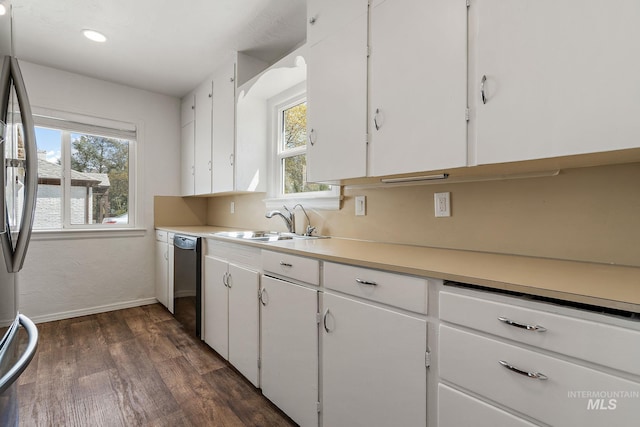kitchen with white cabinetry, dishwasher, a wealth of natural light, and dark wood-style floors