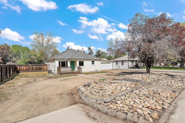 bungalow-style home featuring fence and covered porch