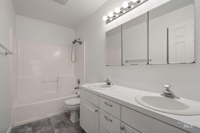 full bathroom with double vanity, a sink, bathing tub / shower combination, and toilet