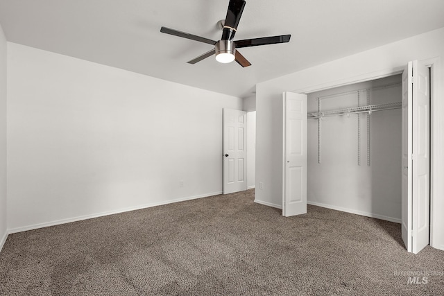 unfurnished bedroom featuring a closet, baseboards, ceiling fan, and carpet flooring